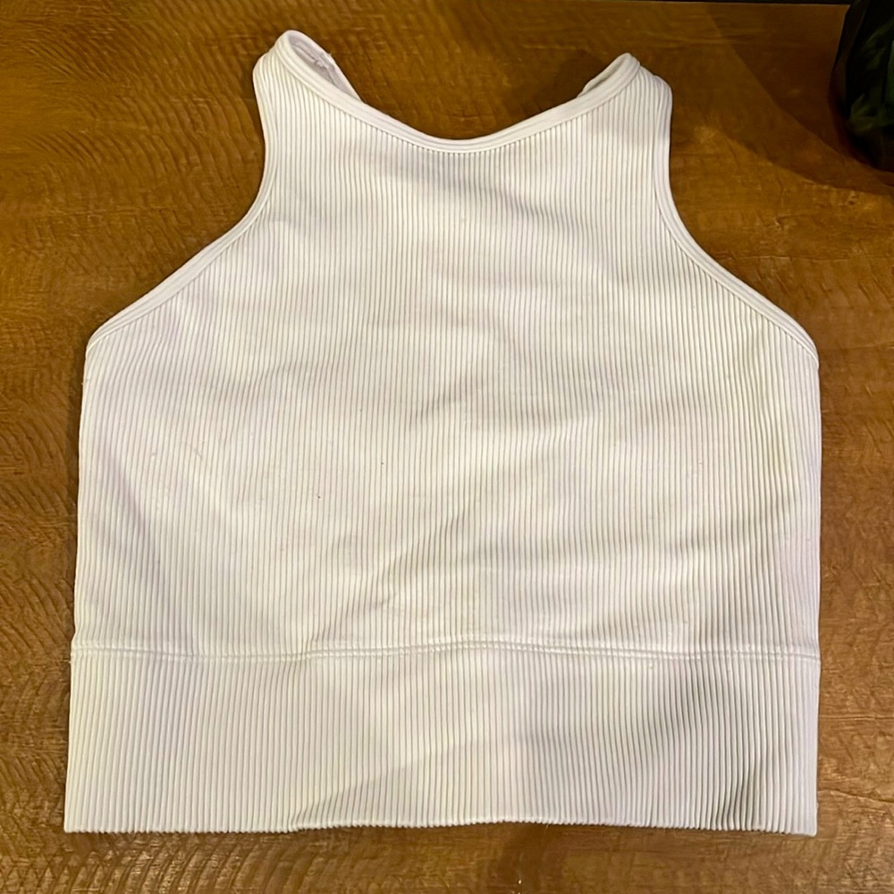 It’s a racer back that is off white and ribbed